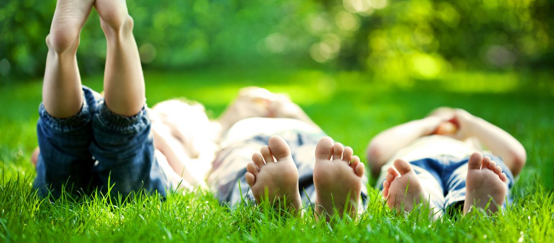 Kids-Laying-In-Grass